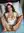 Wavy brunette in open nurse outfit