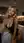 Young curvy blonde kitchen selfie