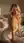 Blonde wavy hair over-the-shoulder bedroom glance