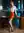 Redhead leans on office desk