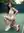 Asian model squats on tennis court