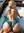 Presley on a wooden boat deck in dark green lace panties