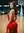 Backless red dress on gym court