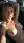 Nude blonde reclines in car seat