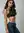 Avani in black halter top and denim jeans