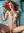 Nude redhead in Kyiv bedroom with legs pulled up