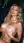 Blonde blue eyes topless in car