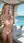 Blonde pulls bra down at beach club