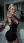 Young blonde kitchen selfie in black dress
