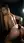 Blonde nude in dark shower