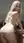 Curvy blonde bent over kitchen counter