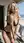 Blonde in micro bikini on balcony