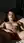 Brunette nude on sunlit bed
