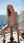 Blonde squatting on yacht dildo