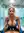 Sloane in blue sports bra and arm sleeves in the gym shower