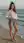 Early 20s brunette beach pose