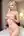 Nude blonde in hotel bedroom