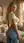 Over shoulder bedroom jeans pose