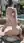Pink pigtails nude by the pool