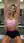 Young curvy blonde stretching in gym locker room