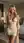 Early 20s blonde in sheer beige dress