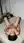 Slim brunette fingers herself on mattress