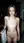 Nude brunette on balcony at night