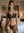 Young adult lingerie bedroom pose