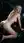 Nude blonde on all fours in car