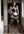 Brunette in maid outfit hallway pose