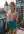 Blonde balcony topless in turquoise skirt