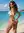 Beach cheek spread in tiny bikini