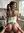 Young adult reverse cowgirl in kitchen