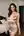 Champagne satin dress bedroom pose