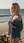 Blonde pulls shirt open beach