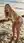 Young adult bent over beach moan