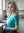Young blonde in casual kitchen pose