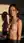 Nude brunette in golden kitchen light