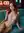 Redhead nude on teal couch
