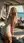 Young adult blonde on beach deck