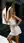 Curvy blonde sundress sway on street