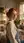 Redhead over shoulder bedroom glance