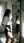 Mid-20s brunette lifts skirt in hallway