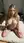 Blonde kneeling nude on mattress