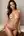 Topless brunette on bed edge