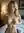 Young blonde squeezes her breasts