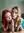 Lara and Emily kneeling together in the bedroom