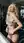 Blonde undressing in bright gym