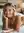 Blonde nude on stomach smiling