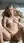 Blonde nude on back in sunlit bed
